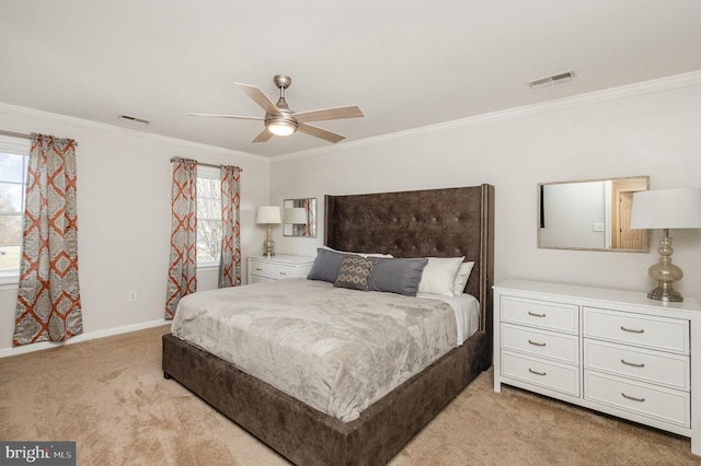 carpeted bedroom featuring crown molding and ceiling fan