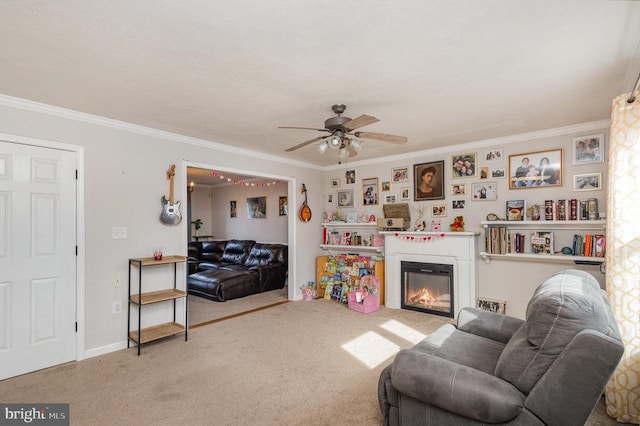 carpeted living room with ornamental molding and ceiling fan