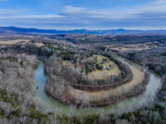 aerial view featuring a water and mountain view