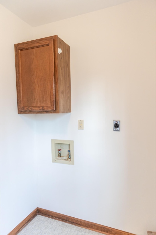 washroom with baseboards, hookup for a washing machine, cabinet space, and electric dryer hookup