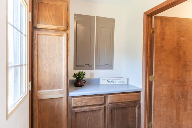 kitchen with brown cabinetry and light countertops