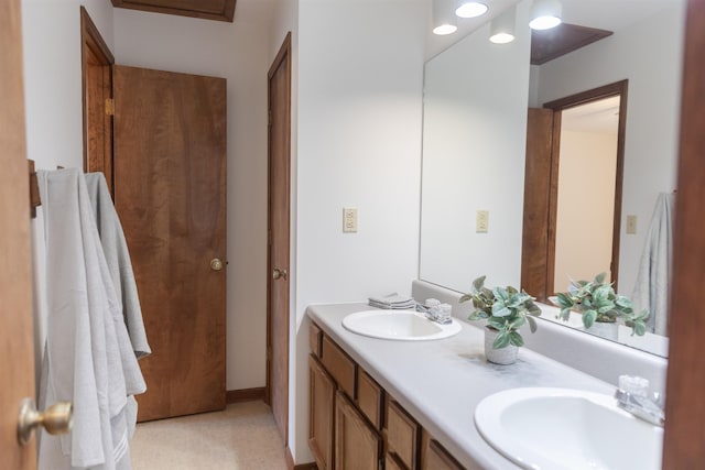 bathroom featuring double vanity and a sink