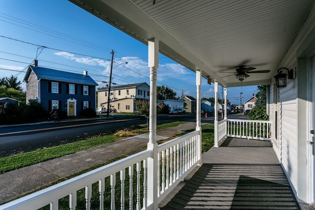 balcony with ceiling fan and covered porch