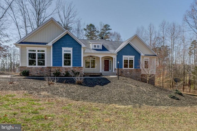 craftsman inspired home featuring stone siding