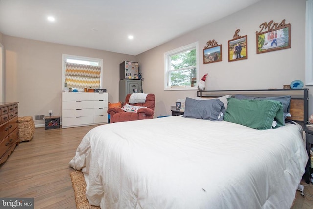 bedroom featuring recessed lighting, visible vents, and light wood finished floors