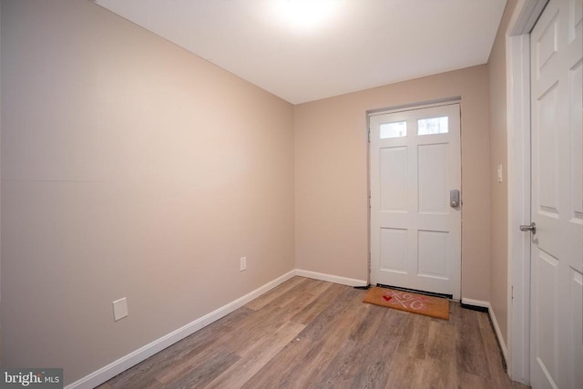 entrance foyer featuring light wood-style floors and baseboards