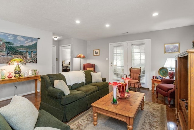 living area featuring recessed lighting, baseboards, and wood finished floors