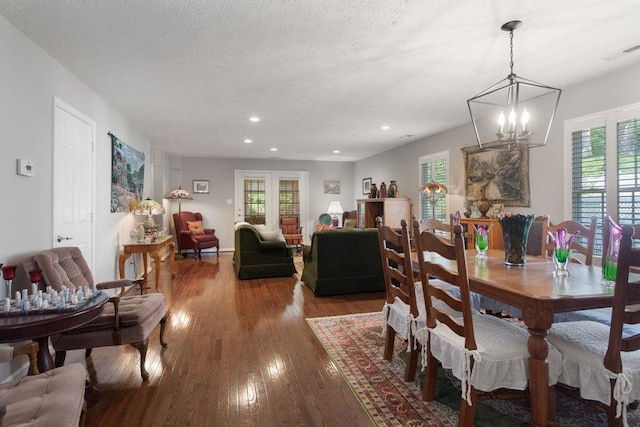 dining area with visible vents, wood finished floors, and a wealth of natural light