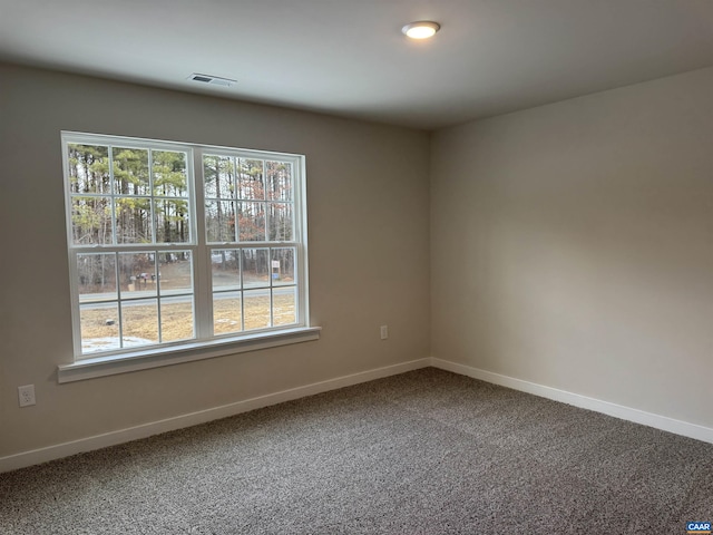 empty room featuring carpet flooring