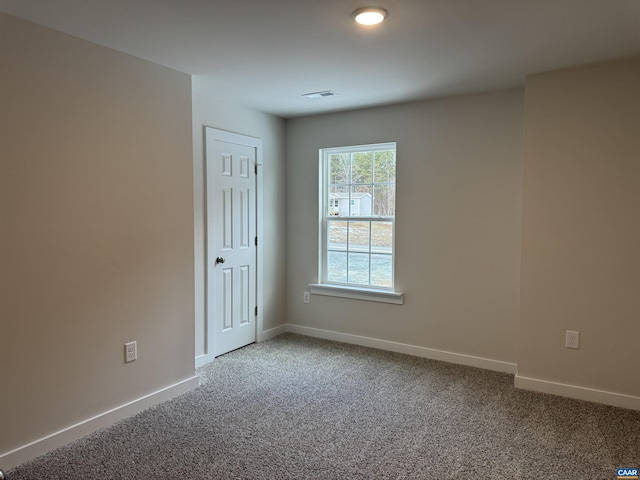 empty room featuring carpet floors