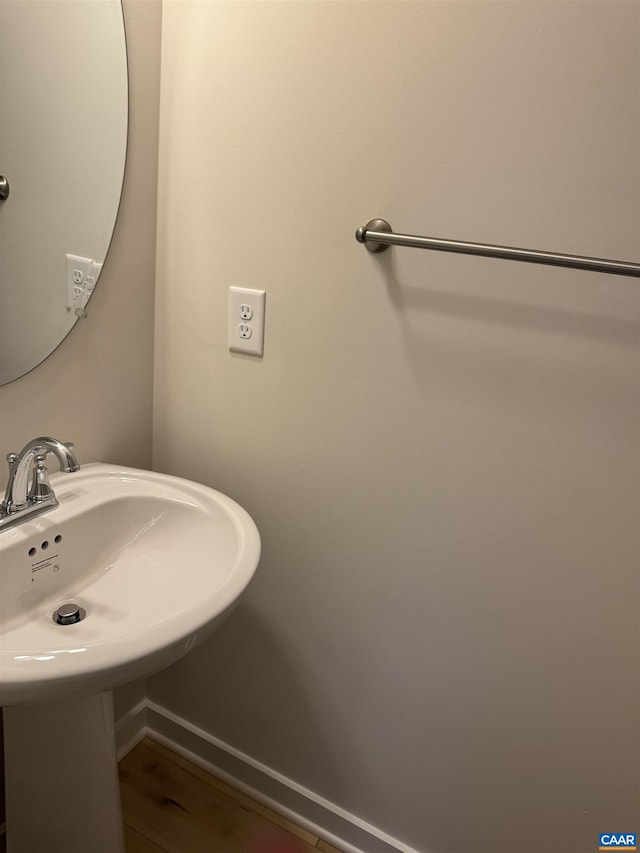 bathroom featuring wood-type flooring