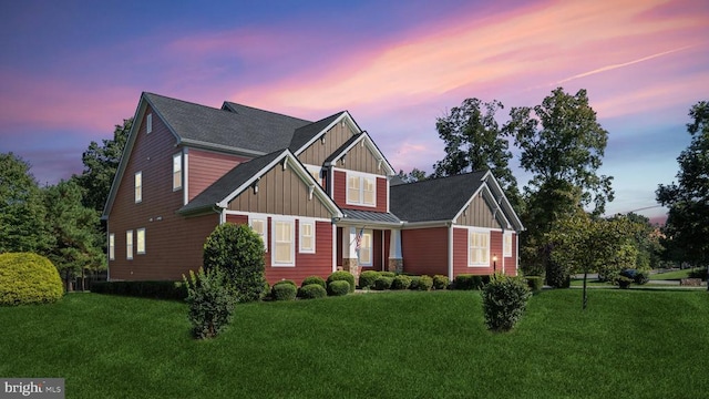 craftsman inspired home featuring board and batten siding and a front yard