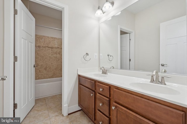 full bathroom featuring tile patterned flooring, a sink, shower / bathtub combination, and double vanity