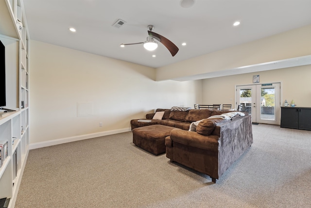 living area featuring light colored carpet, french doors, a ceiling fan, recessed lighting, and visible vents