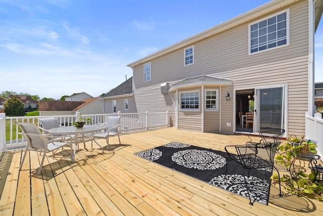 wooden deck with outdoor dining space