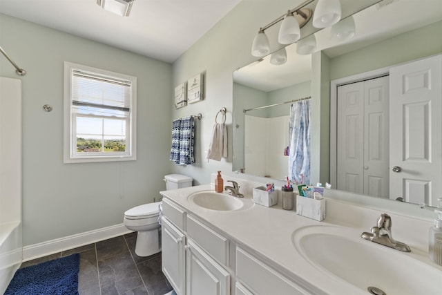 full bathroom featuring baseboards, a sink, visible vents, and toilet