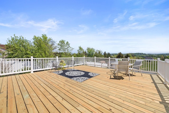 deck with outdoor dining area