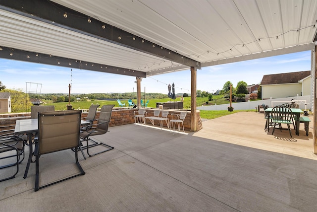 view of patio / terrace featuring fence and outdoor dining space