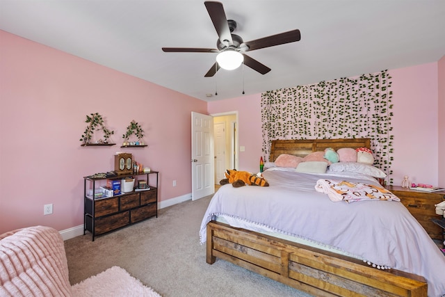bedroom featuring a ceiling fan, baseboards, and carpet