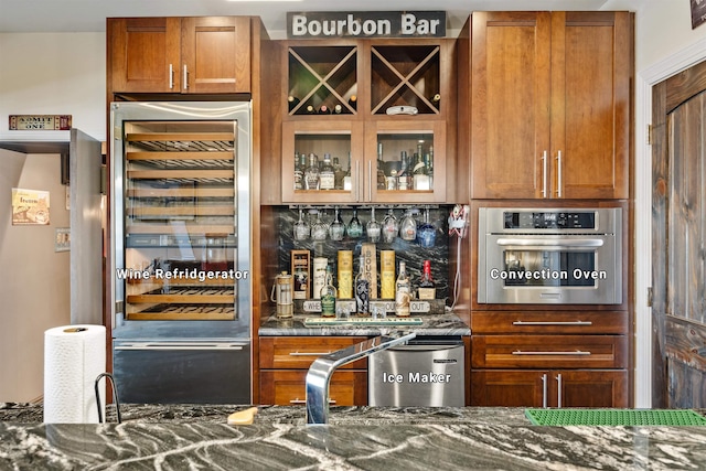 bar featuring oven, a dry bar, a sink, and fridge
