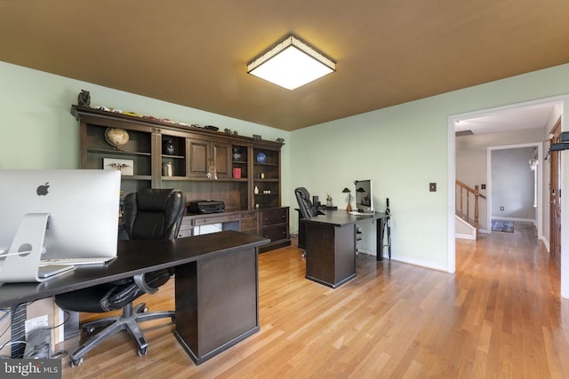 office featuring light wood finished floors and baseboards