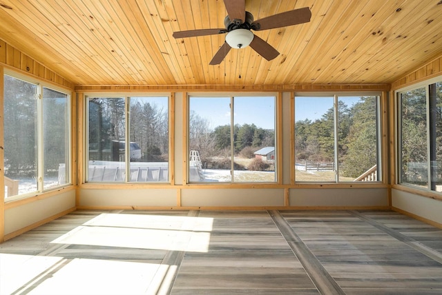 unfurnished sunroom with lofted ceiling, ceiling fan, and wood ceiling