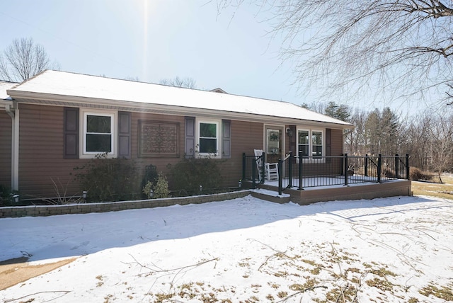 ranch-style home with a wooden deck