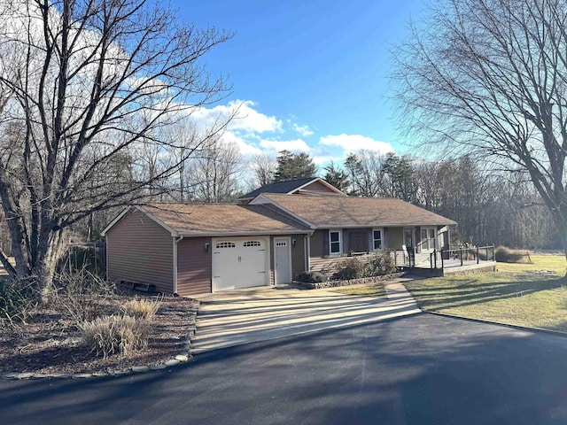 view of front of property with a garage and driveway