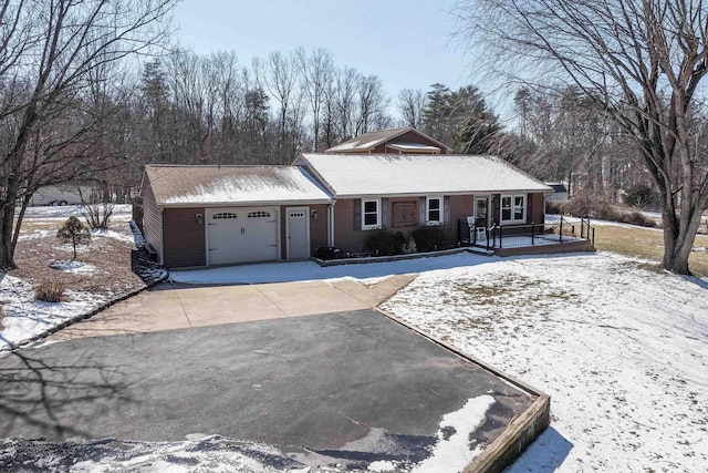 view of front of property with driveway and an attached garage