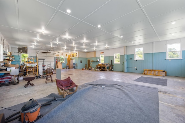 miscellaneous room with unfinished concrete flooring and recessed lighting