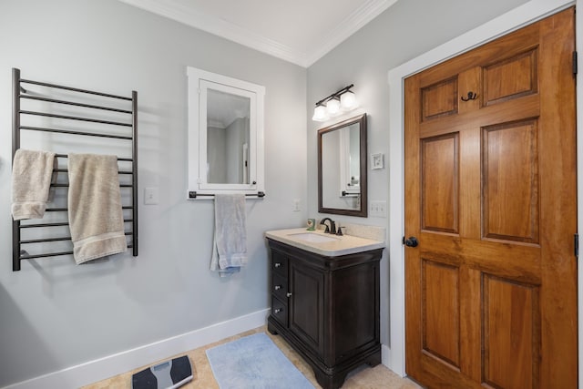 bathroom with baseboards, radiator heating unit, vanity, and crown molding