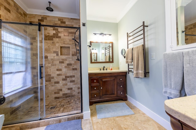 full bathroom with ornamental molding, a stall shower, vanity, and baseboards