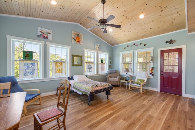 interior space featuring lofted ceiling, ornamental molding, wood ceiling, light wood-type flooring, and baseboards