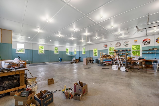 misc room featuring concrete flooring and a workshop area