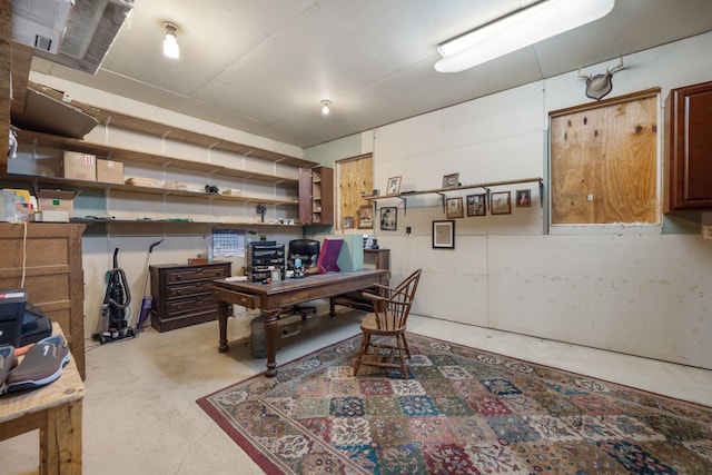 office featuring unfinished concrete flooring