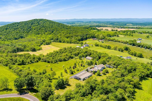 drone / aerial view with a mountain view and a rural view