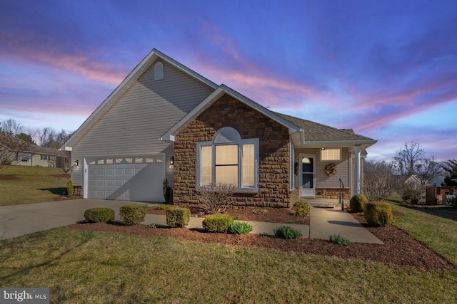 view of front facade featuring driveway, stone siding, a yard, covered porch, and an attached garage