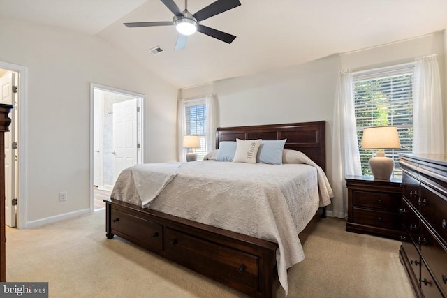 bedroom with light carpet, visible vents, multiple windows, and lofted ceiling