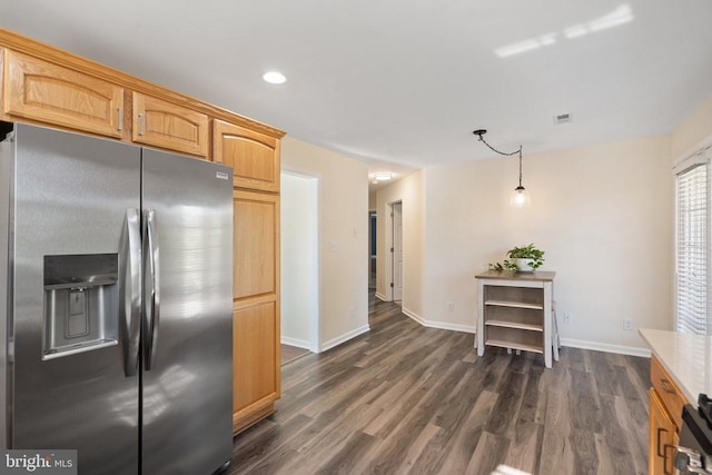 kitchen featuring stove, dark wood-style floors, stainless steel refrigerator with ice dispenser, and baseboards