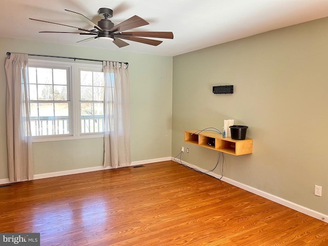 spare room featuring ceiling fan and light wood-type flooring