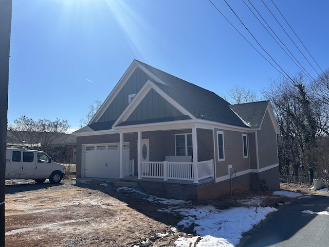 view of front of house featuring a garage and covered porch