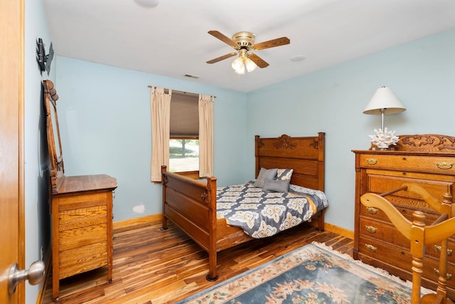 bedroom featuring hardwood / wood-style flooring and ceiling fan