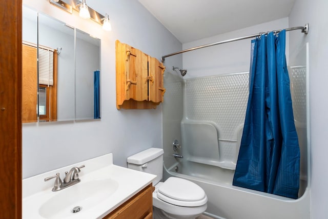 full bathroom featuring shower / tub combo, vanity, and toilet