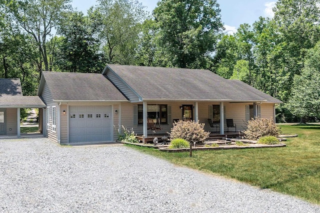 single story home featuring a garage, a front yard, and a porch