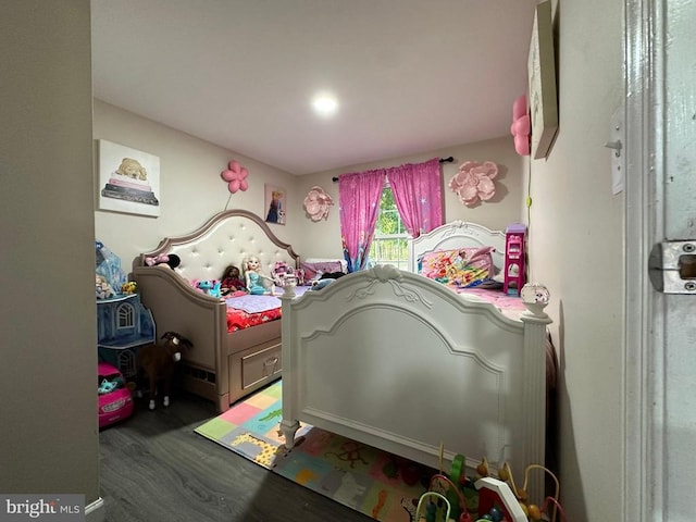 bedroom with dark wood-type flooring