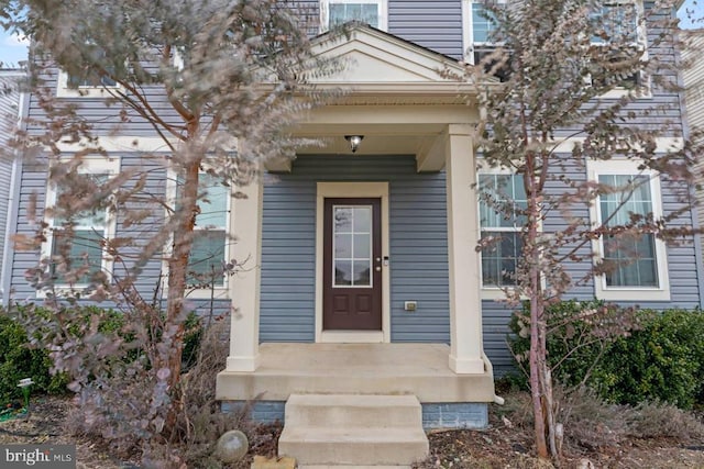 entrance to property featuring a chimney