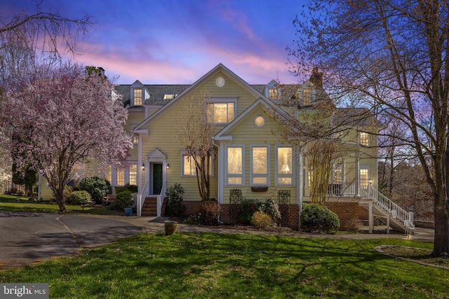 view of front of house with a lawn