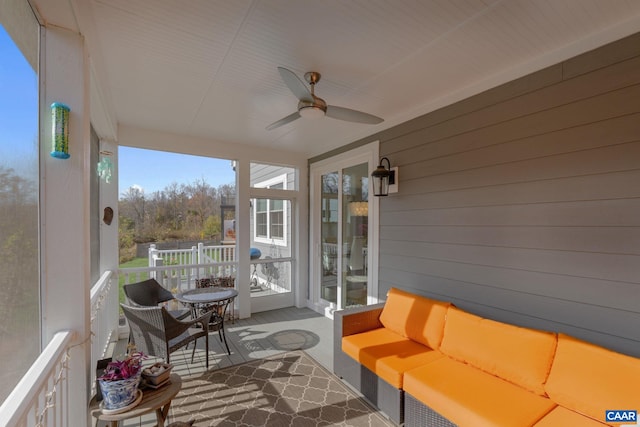 sunroom with a ceiling fan