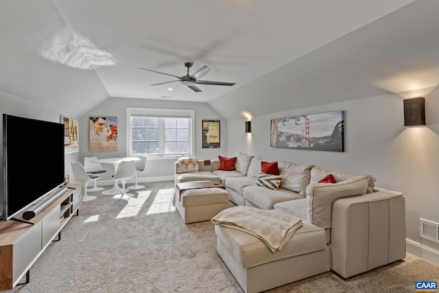 living area with lofted ceiling, carpet floors, and ceiling fan