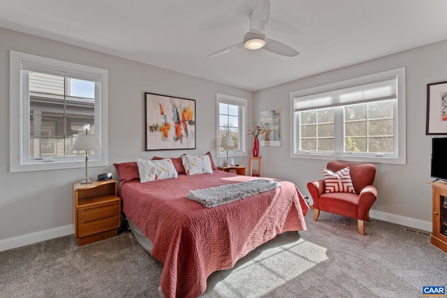 carpeted bedroom with baseboards and ceiling fan